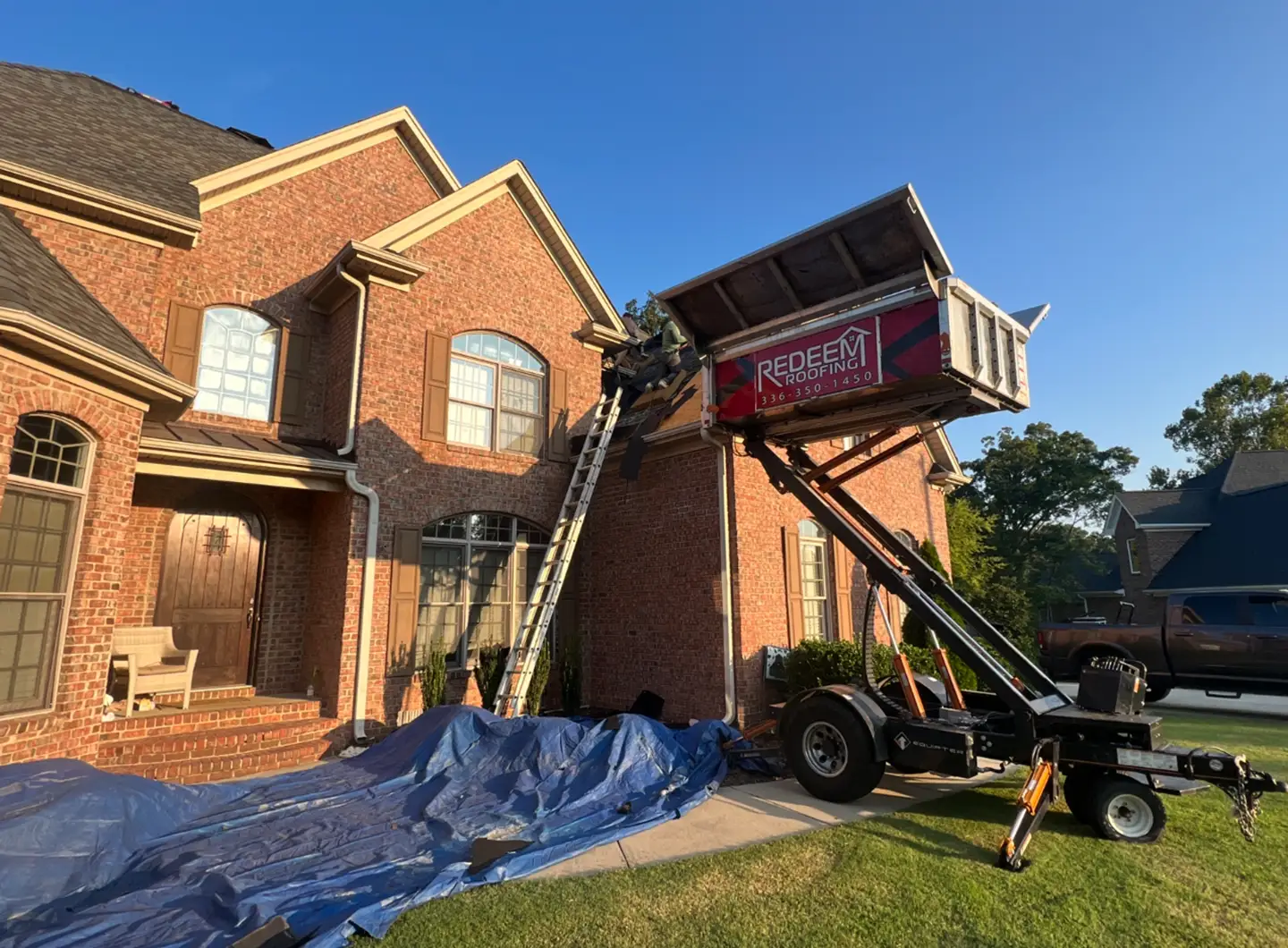 Clean, protected job site during a Redeem Roofing replacement